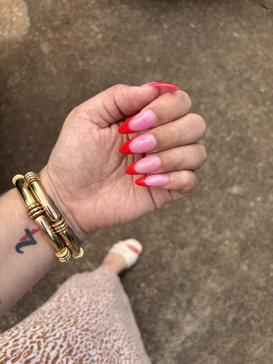 Pink almond nails with bright red French tips