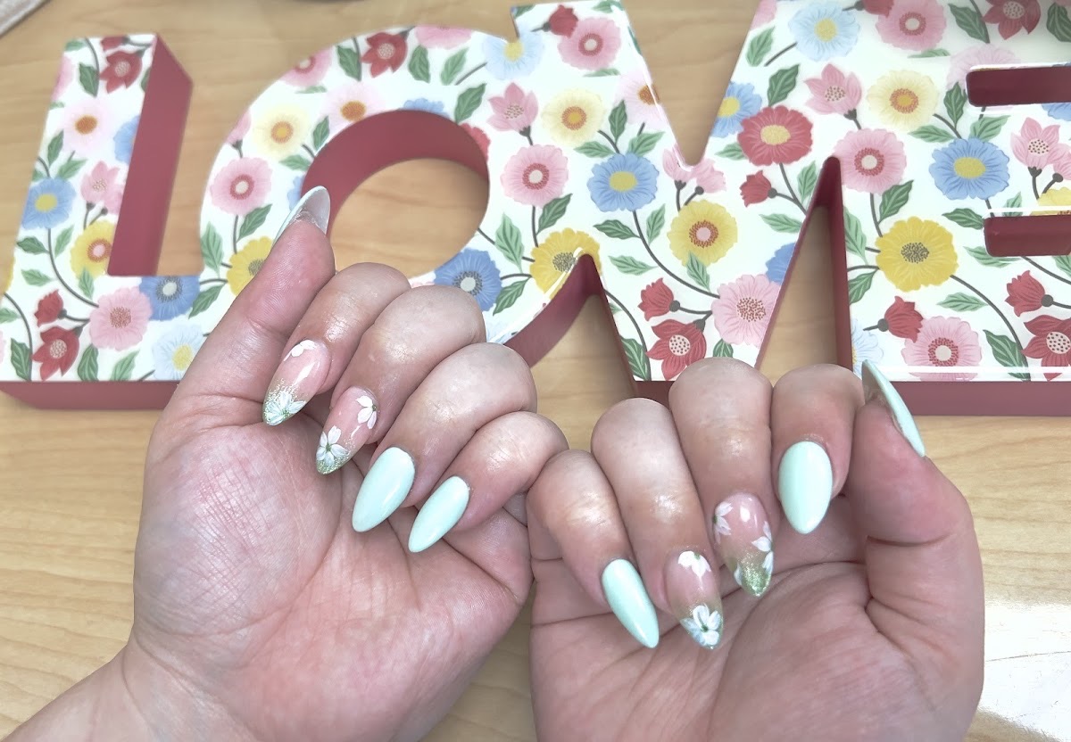 Soft mint and cherry-blossom nail art photographed at V Nails